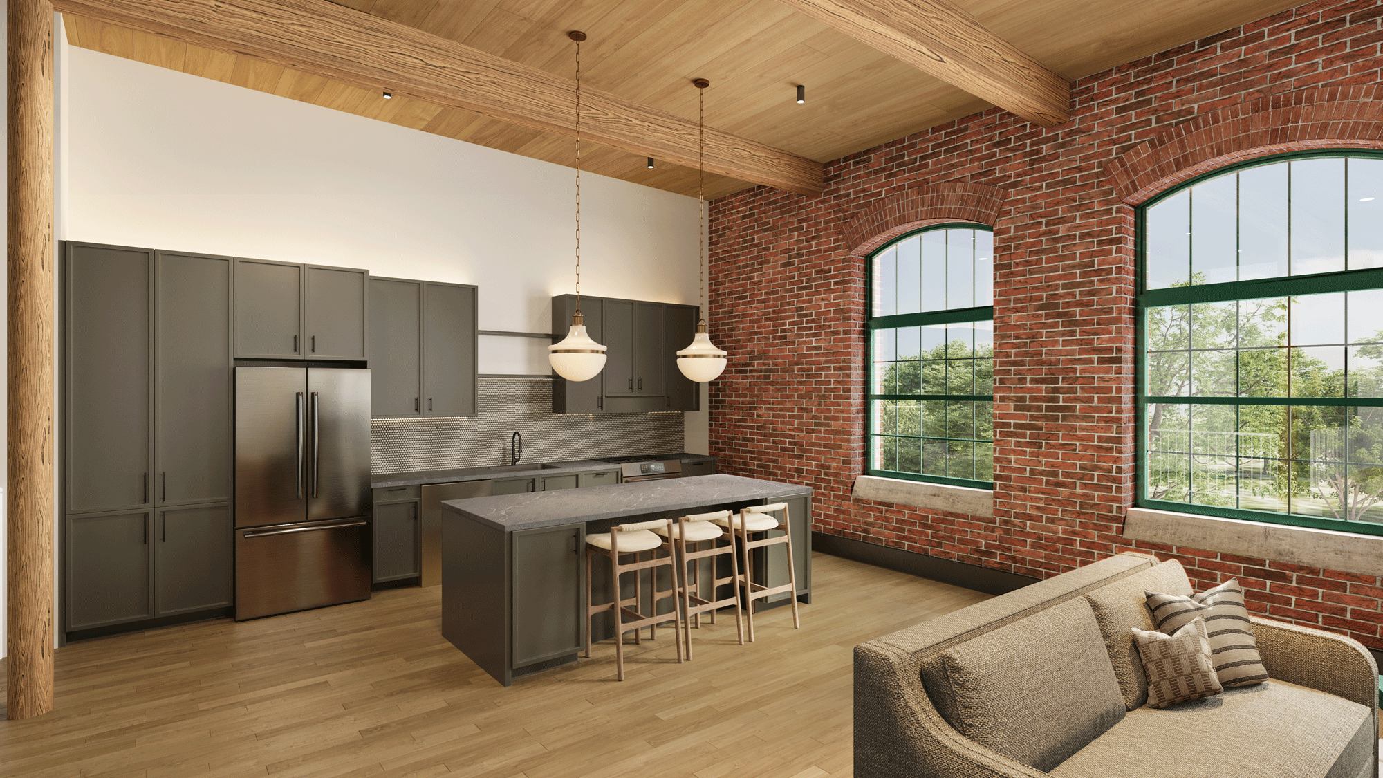 Loft-style apartment interior at the Pattern District in Newton Upper Falls, MA, featuring exposed brick walls, wood beam ceilings, and an open-concept kitchen.