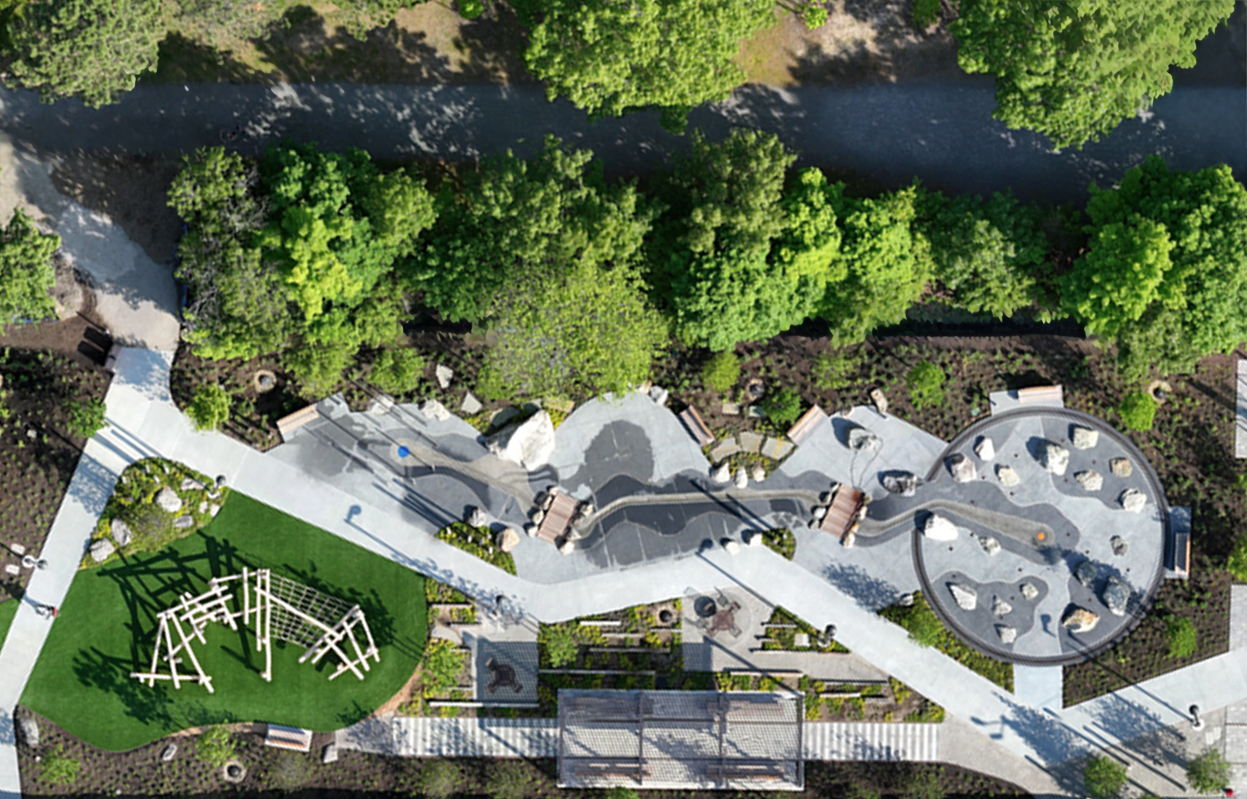 Aerial view of the splash park and outdoor recreation area at the Pattern District in Newton Upper Falls, MA.