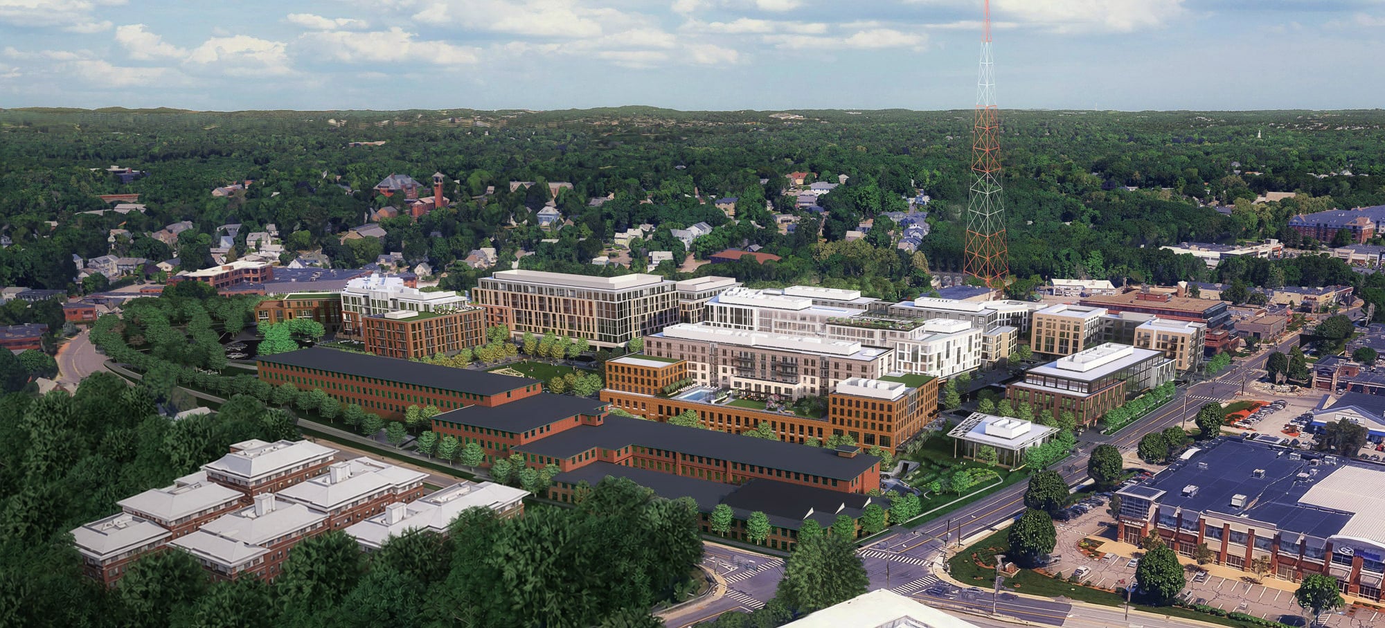 Aerial view of the Pattern District in Newton Upper Falls, MA, featuring mixed-use buildings, walkable streets, and the Village Green.